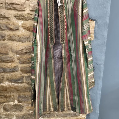 Lot 294 - A green and purple striped long sleeved...