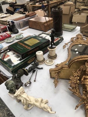 Lot 592 - A three light table lamp supported by a Cupid...