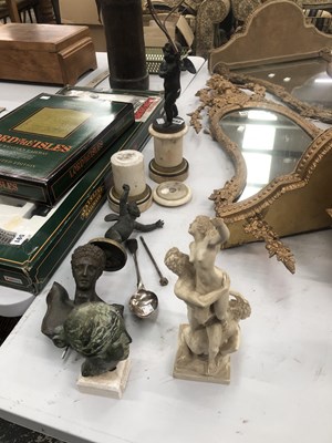 Lot 592 - A three light table lamp supported by a Cupid...