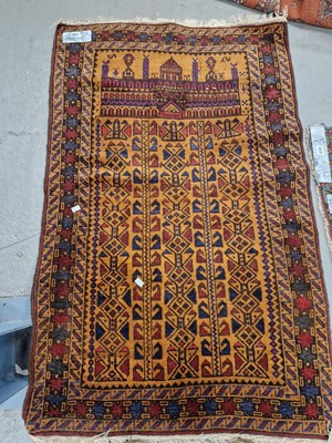 Lot 651 - An interesting Afghan prayer rug. 135 x 88cms