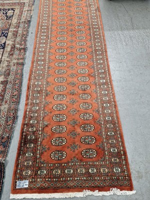 Lot 652 - An Oriental runner of Bokhara design. 368 x 97cms