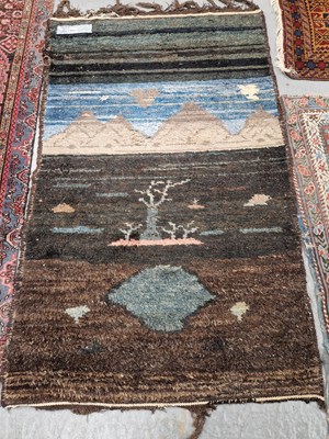 Lot 654 - An interesting tribal pictorial rug. 160 x 100cms