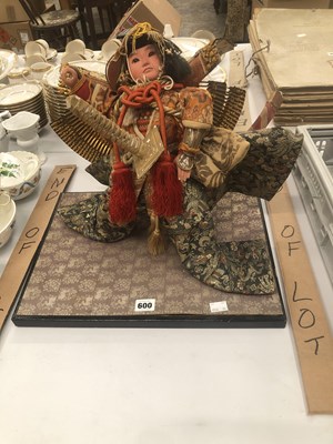 Lot 600 - A child samurai doll
