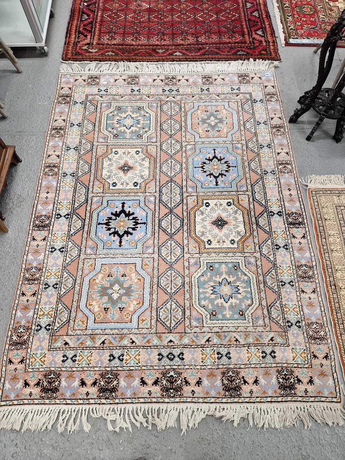 Lot 664 - An Oriental rug of unusual design. 157 x 211cms