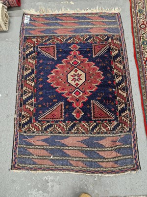 Lot 669 - An antique Belouch rug