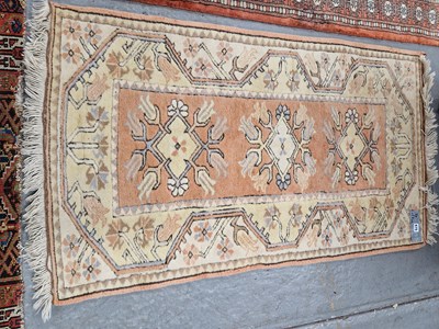 Lot 675 - A Turkish tribal rug