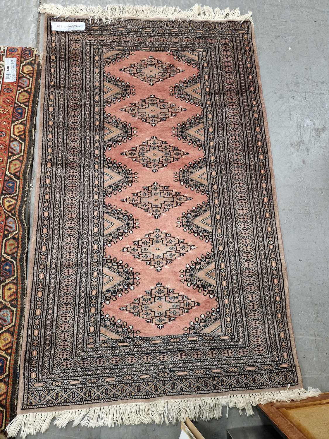 Lot 676 - An Oriental rug of Turkoman design