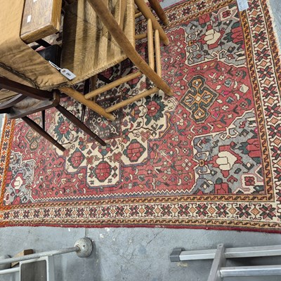 Lot 677 - A Persian tribal rug