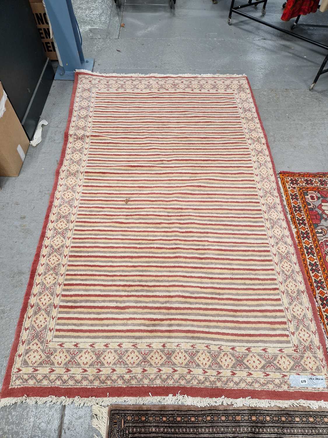 Lot 678 - An Oriental rug of unusual design