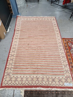 Lot 678 - An Orienatal rug of unusual design