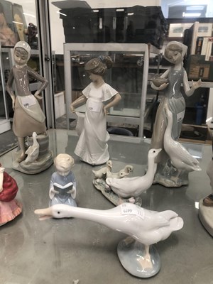 Lot 619 - Eight porcelain figures by Lladro, Copenhagen...