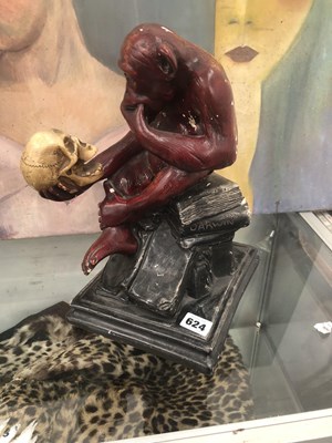 Lot 624 - A painted plaster figure of a monkey...