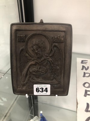 Lot 634 - A bronze icon depicting a winged saint holding...