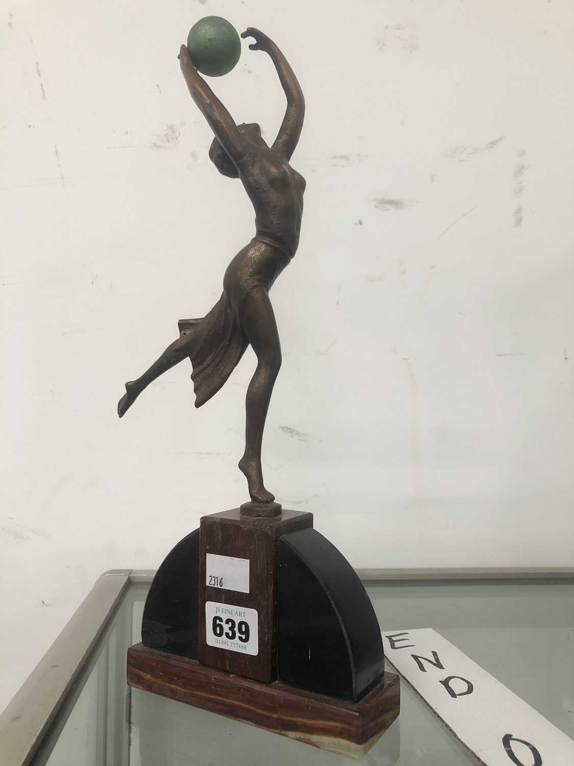 Lot 639 - An Art Deco copper rich figure of a lady...