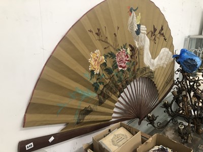 Lot 646 - A large Japanese fan with bamboo sticks, the...