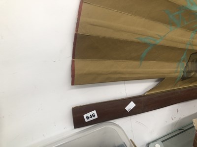 Lot 646 - A large Japanese fan with bamboo sticks, the...