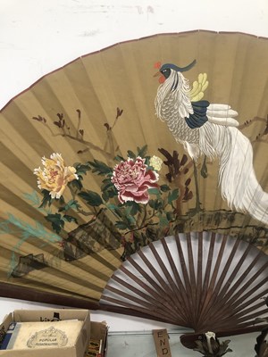 Lot 646 - A large Japanese fan with bamboo sticks, the...