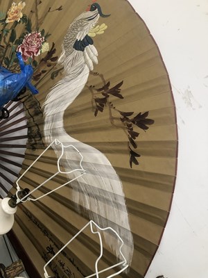 Lot 646 - A large Japanese fan with bamboo sticks, the...