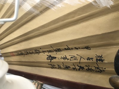 Lot 646 - A large Japanese fan with bamboo sticks, the...