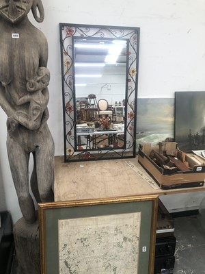 Lot 664 - A rectangular mirror in an iron frame pierced...