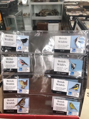 Lot 688 - Star wars figures, enamel bird badges, shop...