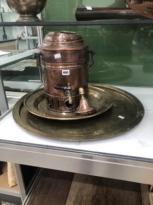Lot 693 - A copper tea urn together with two brass...