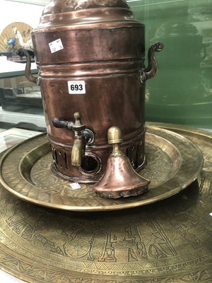 Lot 693 - A copper tea urn together with two brass...