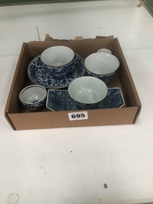 Lot 695 - Four Chinese blue and white tea bowls, a...