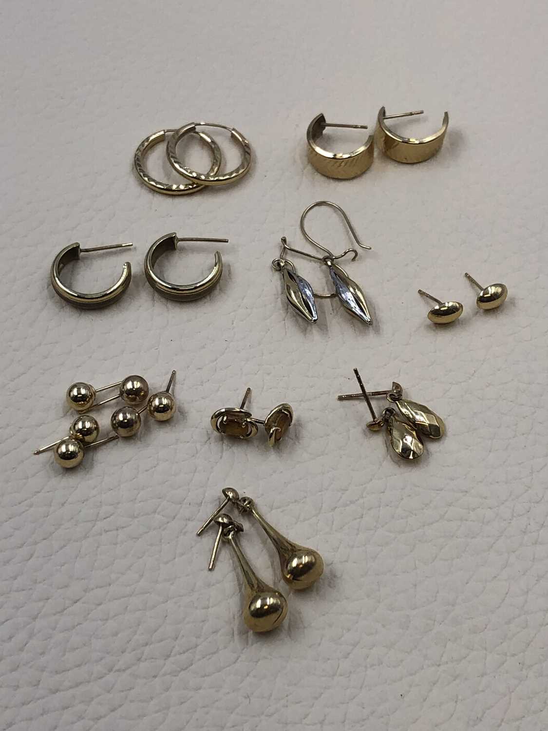Lot 70 - Eleven pairs of gold earrings, one gem-set...