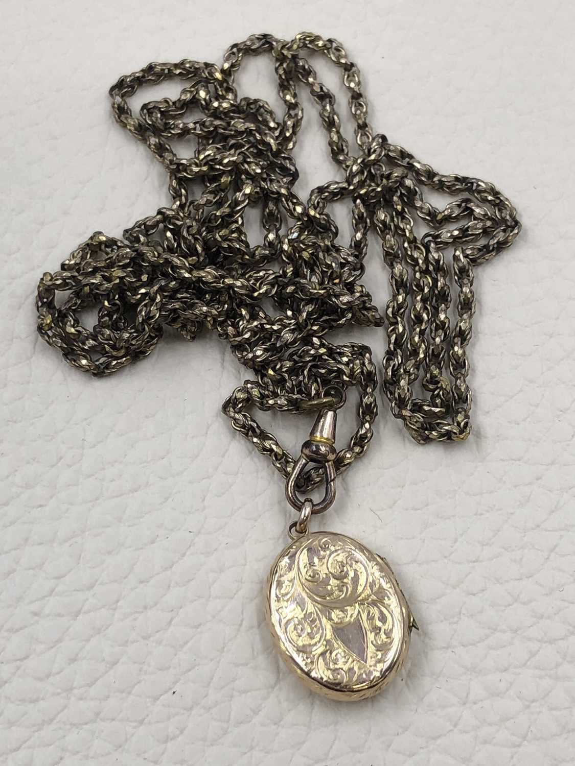 Lot 72 - A 9ct Chester hallmarked oval locket on a...