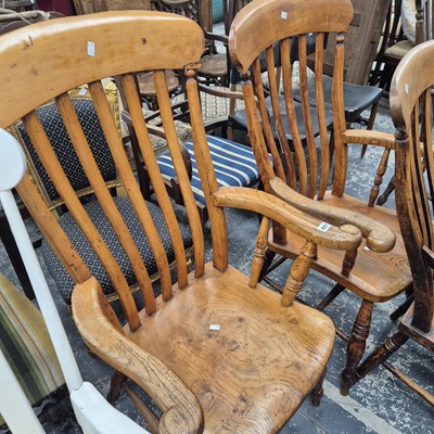 Lot 857 - Two antique country kitchen slat back armchairs.