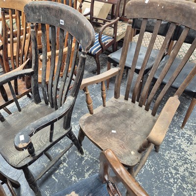 Lot 860 - Two antique rustic kitchen slat back armchairs.