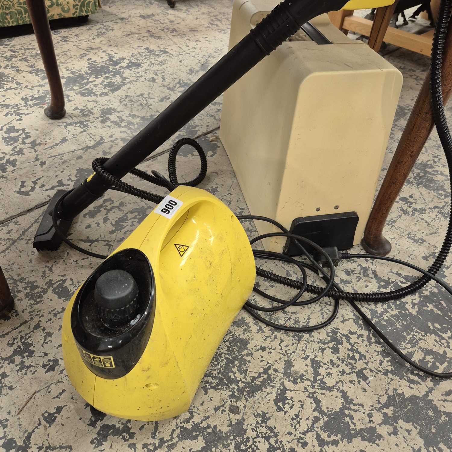 Lot 900 - A sewing machine and a portable small steam...
