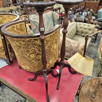 Lot 902 - A pair of tripod base torchere.