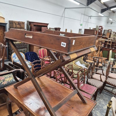 Lot 908 - A mahogany butlers tray of folding stand.