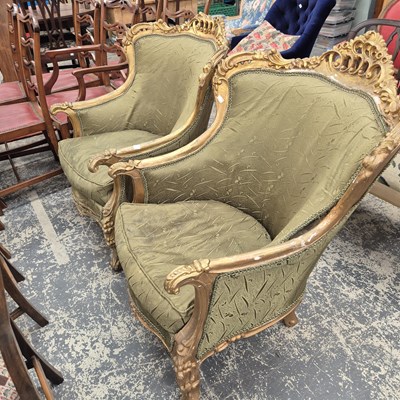 Lot 934 - A pair of gilt show frame armchairs.