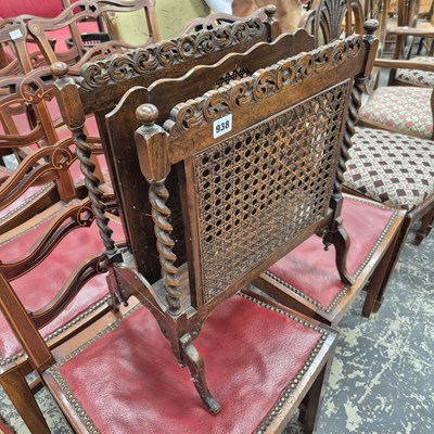 Lot 938 - An early 20th century oak magazine stand.