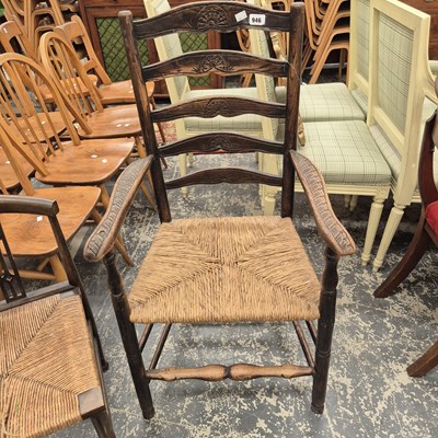 Lot 946 - A ladder back country armchair.