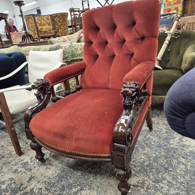 Lot 957 - A Victorian carved show frame armchair.
