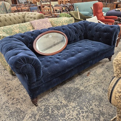 Lot 959 - An antique. blue velvet button upholstered...