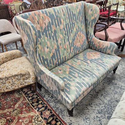 Lot 964 - A small wing back sofa / settee