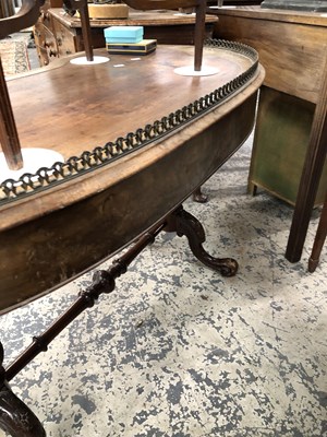 Lot 975 - A Victorian walnut kidney shape writing table...