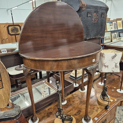 Lot 977 - A Mahogany fold over tea table