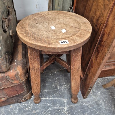 Lot 991 - an oak stool.