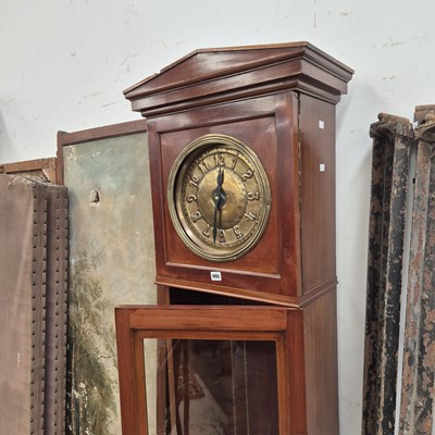 Lot 995 - An arts and crafts longcase clock.