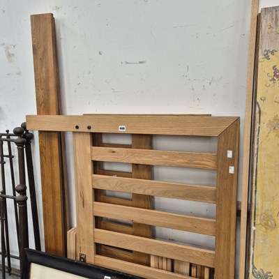 Lot 999 - An oak double bed.