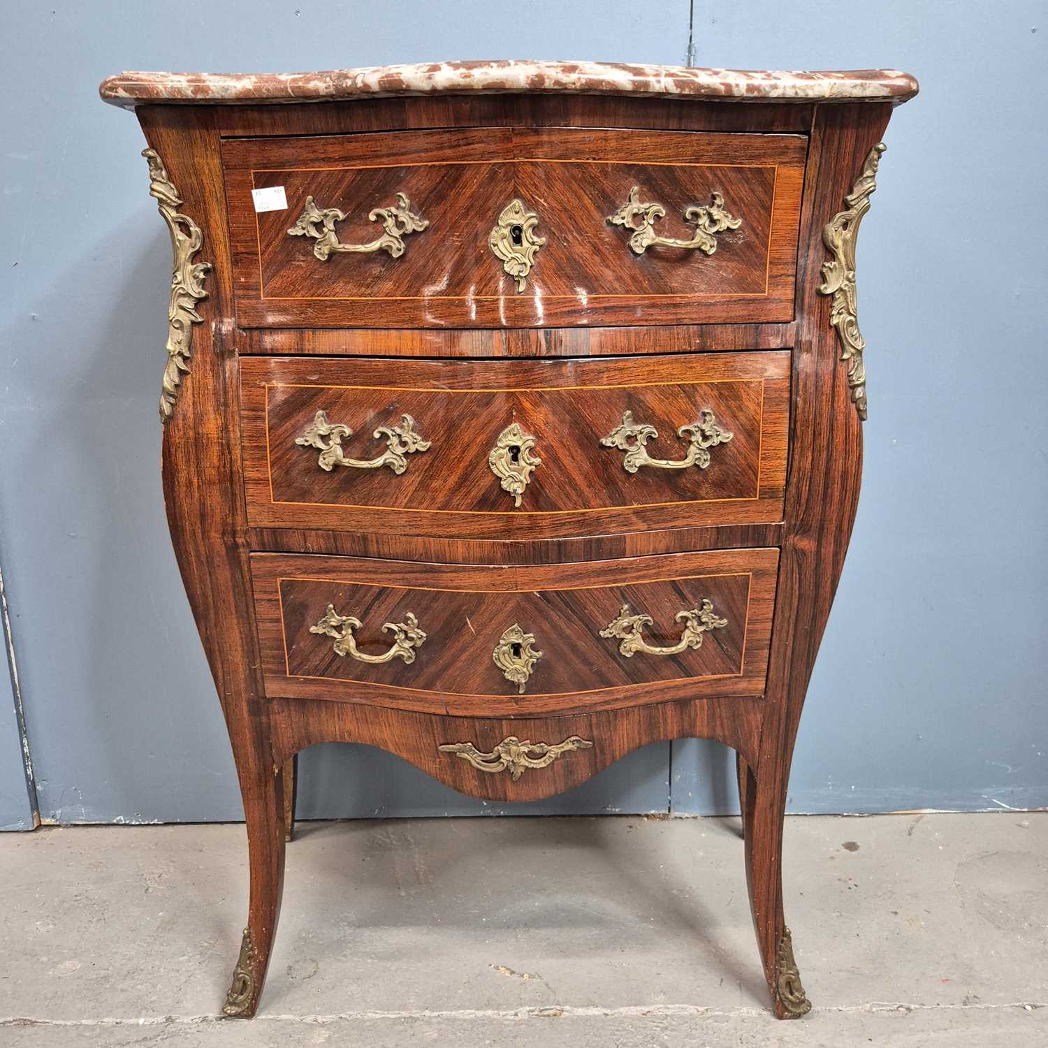 Lot 302 - A red marble topped rosewood commode of three...