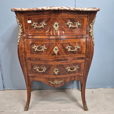 Lot 302 - A red marble topped rosewood commode of three...