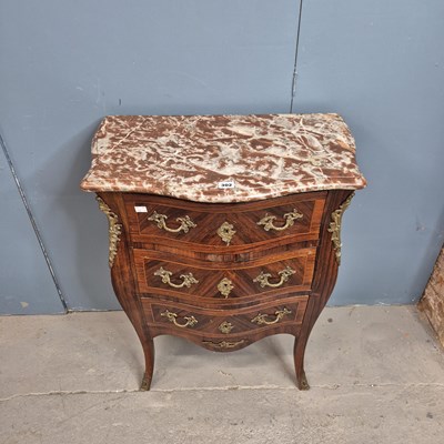 Lot 302 - A red marble topped rosewood commode of three...