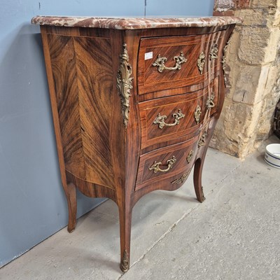 Lot 302 - A red marble topped rosewood commode of three...